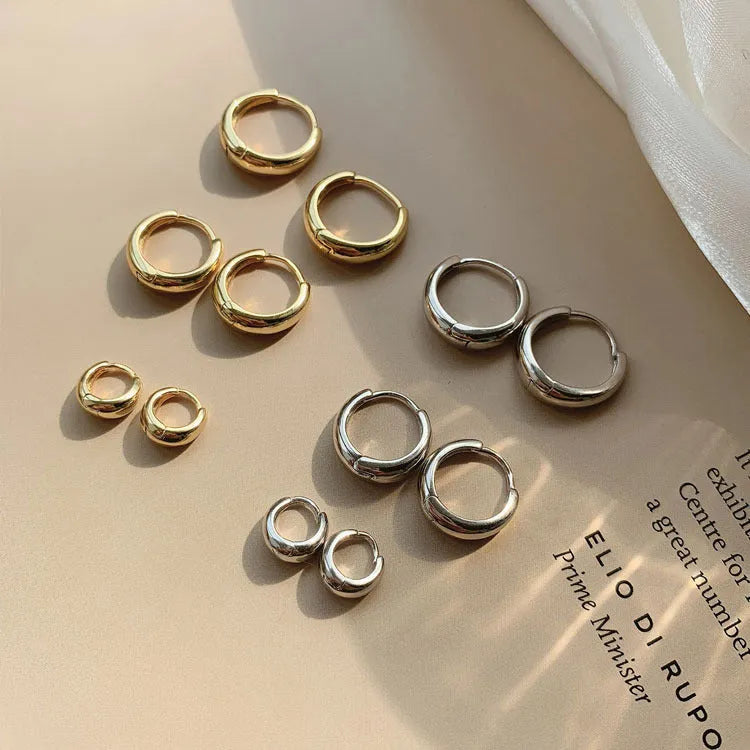 Women's geometric water drop earrings in gold or silver with retro minimalist circular design