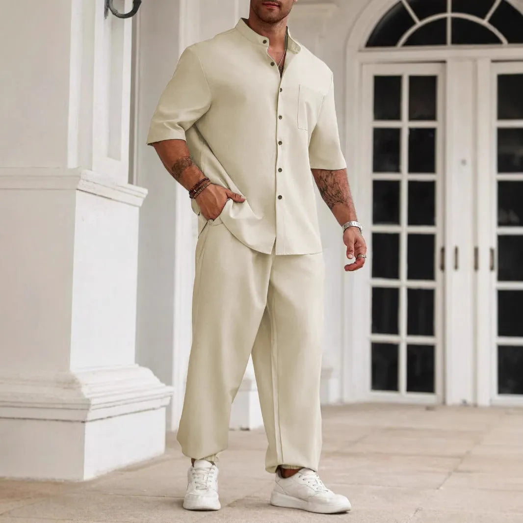 Men's casual apricot coloured cotton linen short sleeve shirt and trousers set laid flat.