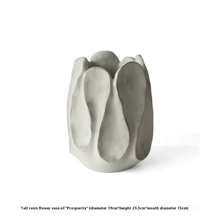 Irregular ceramic vase for flower arrangements in high style or low style profile