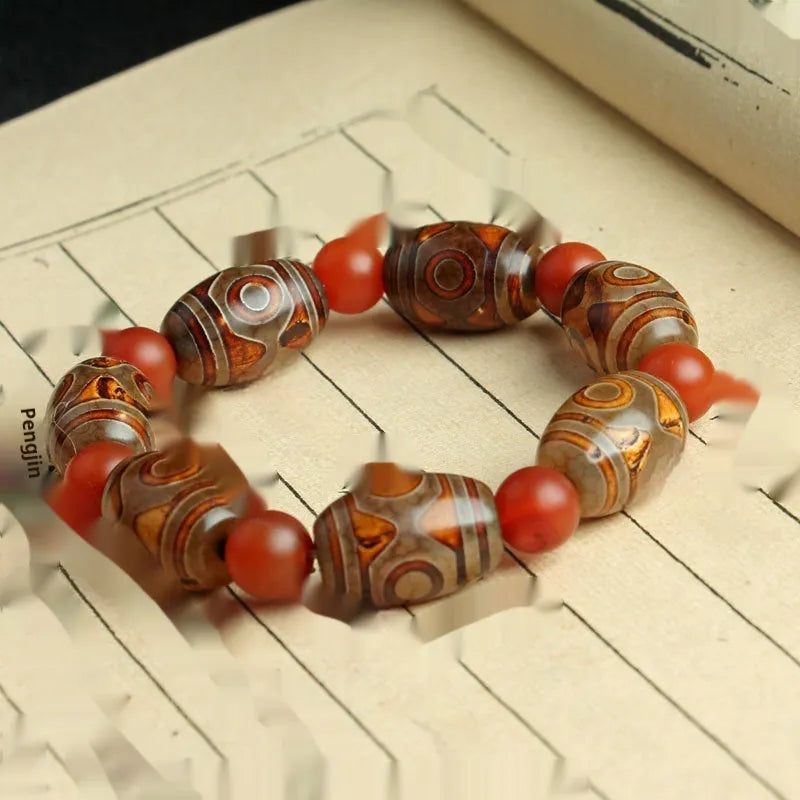 Agate Tibetan dzi bead bracelet with three-eye design and polished finish
