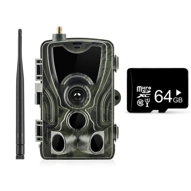 Outdoor camouflage surveillance camera with wide-angle lens on a green background.