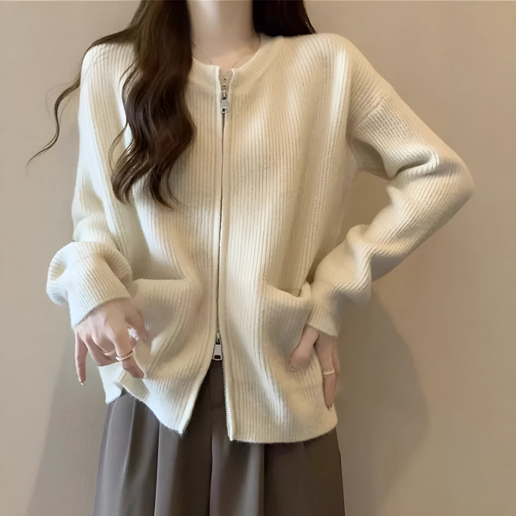 Beige viscose fibre soft wind cardigan coat with long sleeves on a hanger.