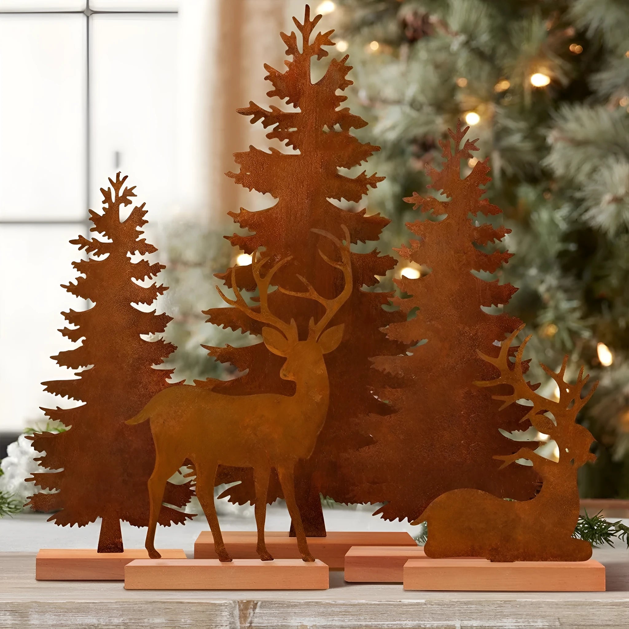 Set of three rusty metal Christmas tree ornaments with elk designs on a rustic background.