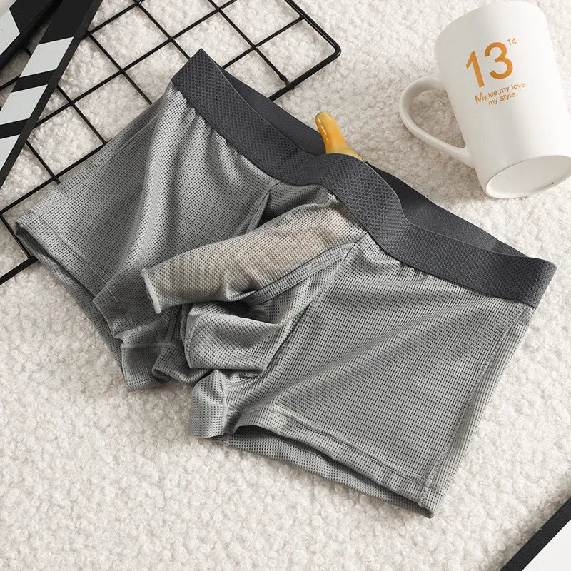 Men's black ice silk boxer shorts with a low waistband and mesh fabric panels.