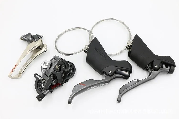 Road bike transmission kit showing aluminium alloy manual shifter, front derailleur and short-leg rear derailleur components