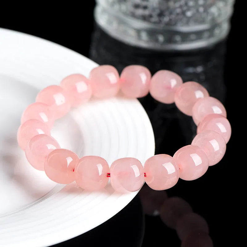 Natural pink crystal barrel-bead bracelet with 8x10mm polished geometry beads