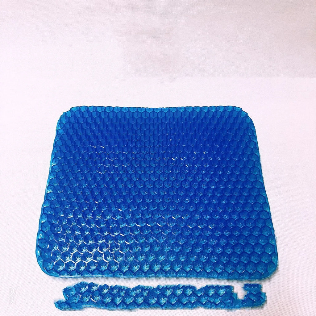 Square honeycomb-pattern gel seat cushion with a removable cover for pressure relief.