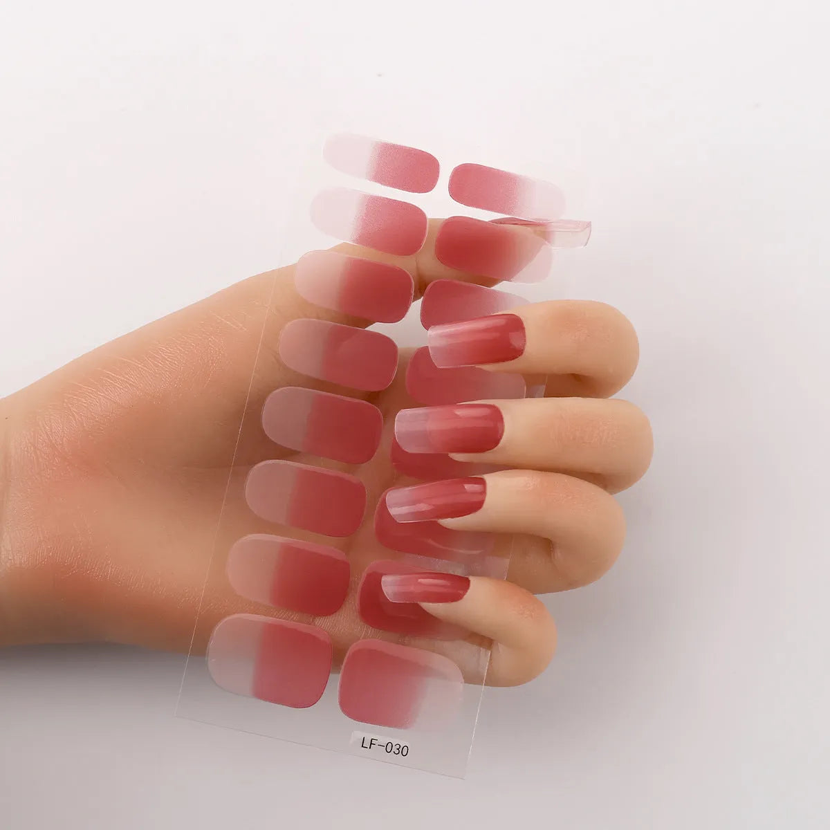 Full nail art sticker sheet showing 16 different solid colour designs including European simple nails and floral patterns