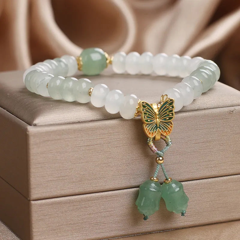 Green crystal women's bracelet with Tian Shan Cui abacus beads and retro butterfly tassel design measuring 17 cm