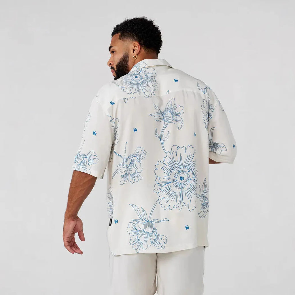 Men's loose fit floral print short sleeve top in polyester fabric shown in beige colour