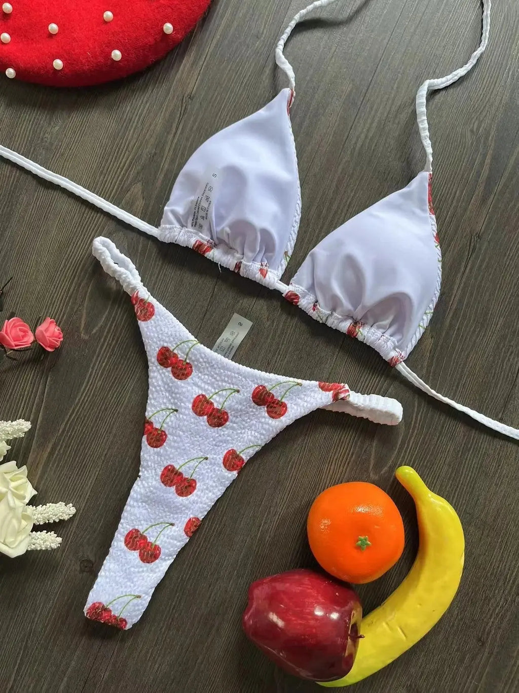 Women's bikini swimsuit with printed fabric in briefs style, showing high elasticity and cotton lining