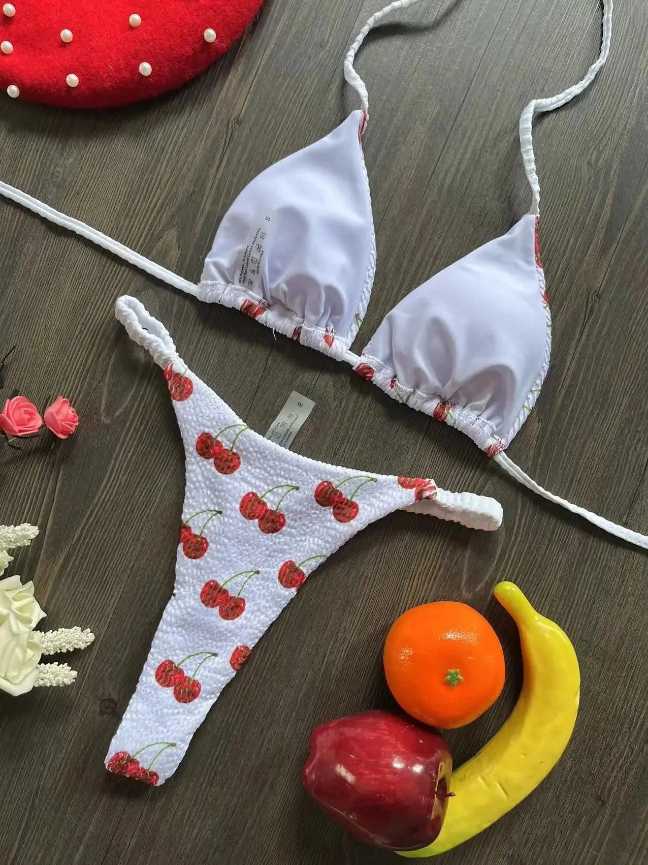 Women's bikini swimsuit with printed fabric in briefs style, showing high elasticity and cotton lining