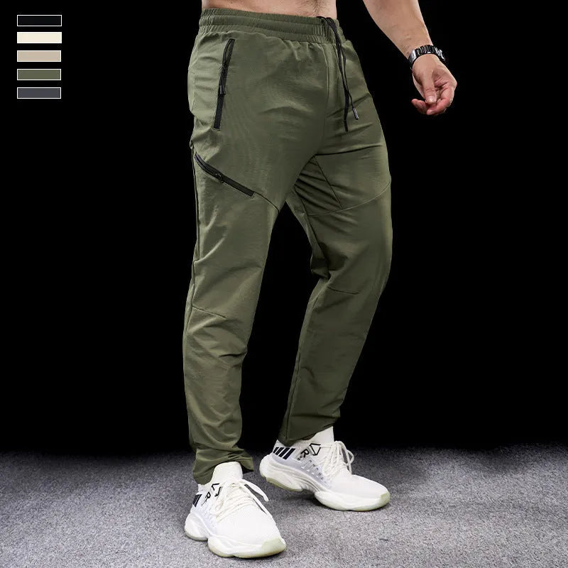 Men's waterproof quick-dry nylon exercise trousers in Army Green colour with mid waist design