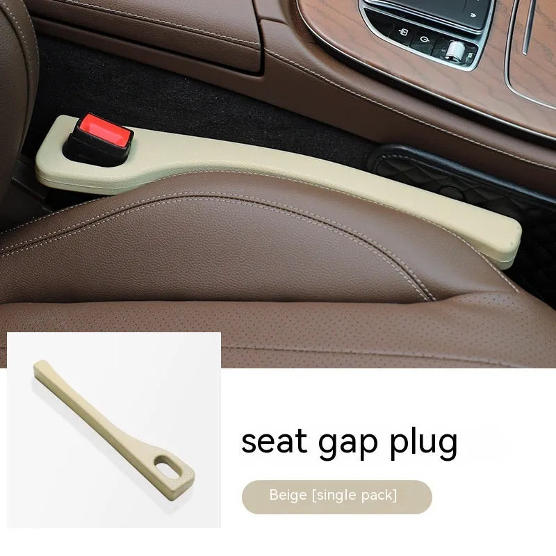 Flexible polyurethane car seat gap filler strip in beige colour on a car seat.