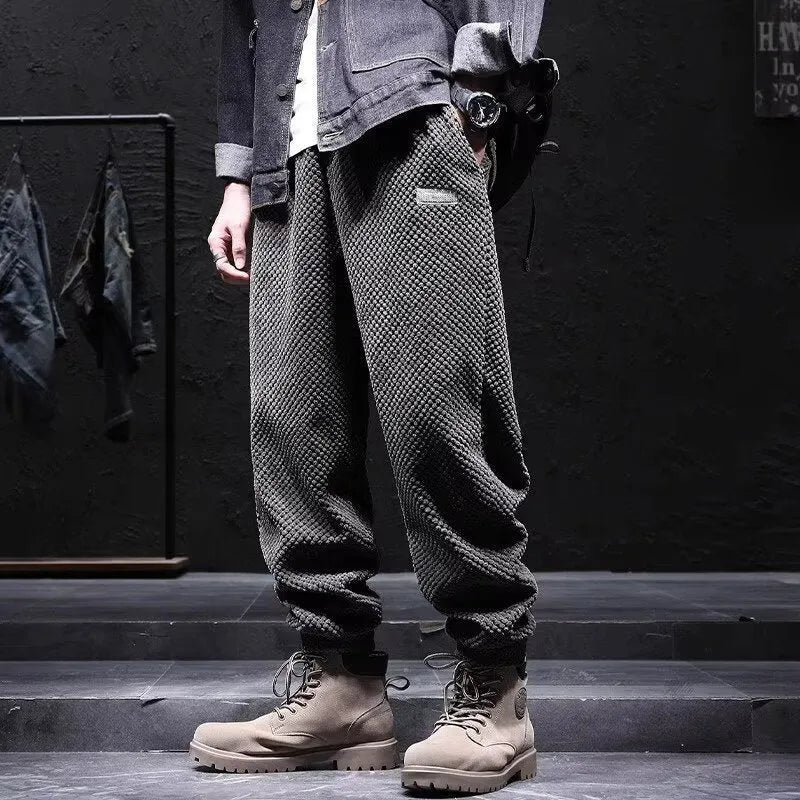 Men's grey ankle-tie casual sweatpants with straight leg design on hanger