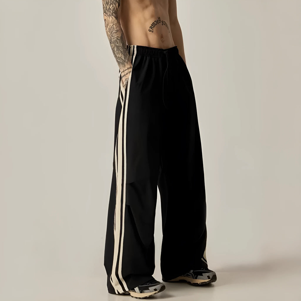 Black wide-leg climbing trousers with high waist design shown flat