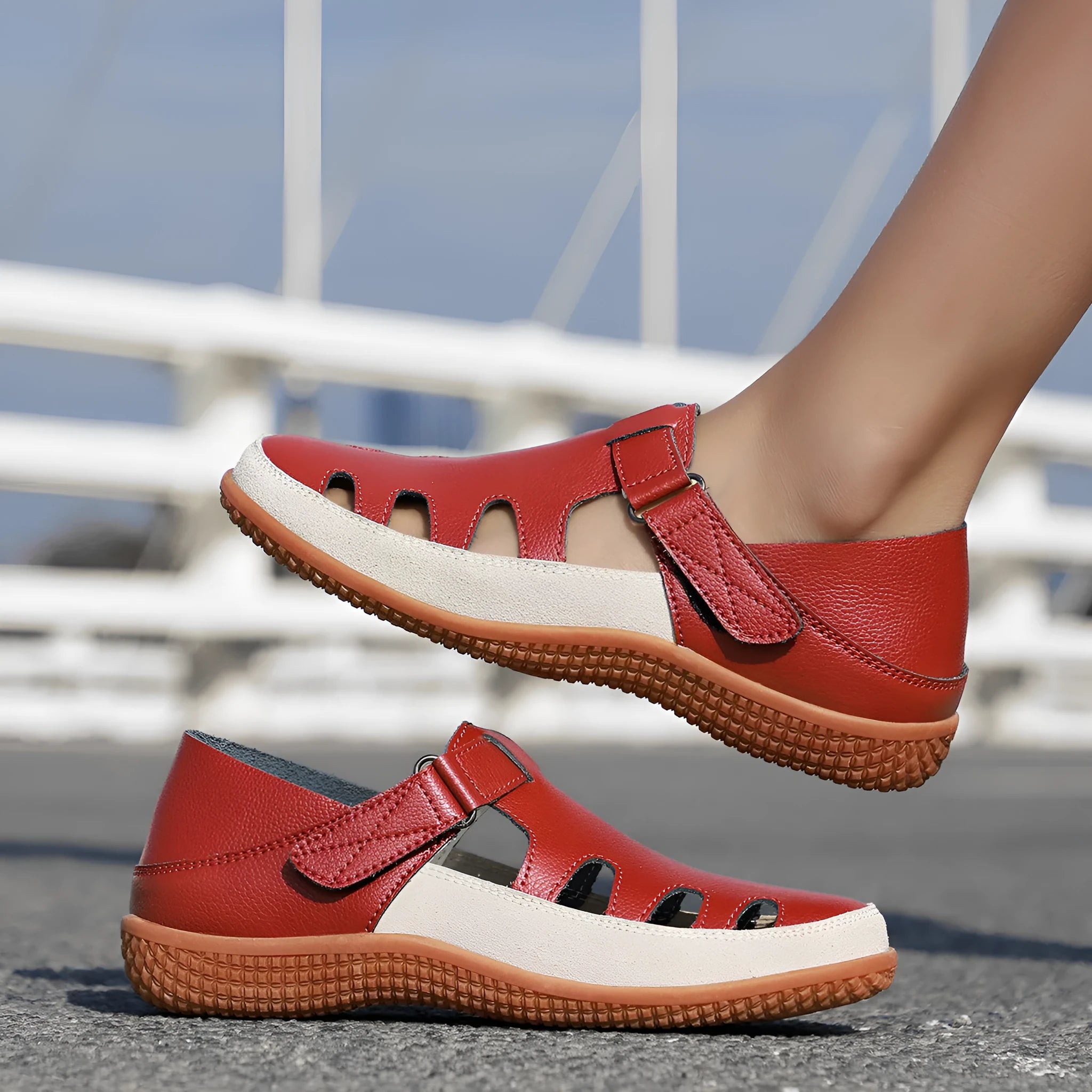 Women's plus size flat sandals with hollow-out toe cap in red, white, or blue on a thick rubber sole.