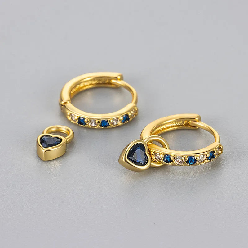 Women's copper earrings with heart-shaped drops and coloured stone accents in gold or white gold tone settings