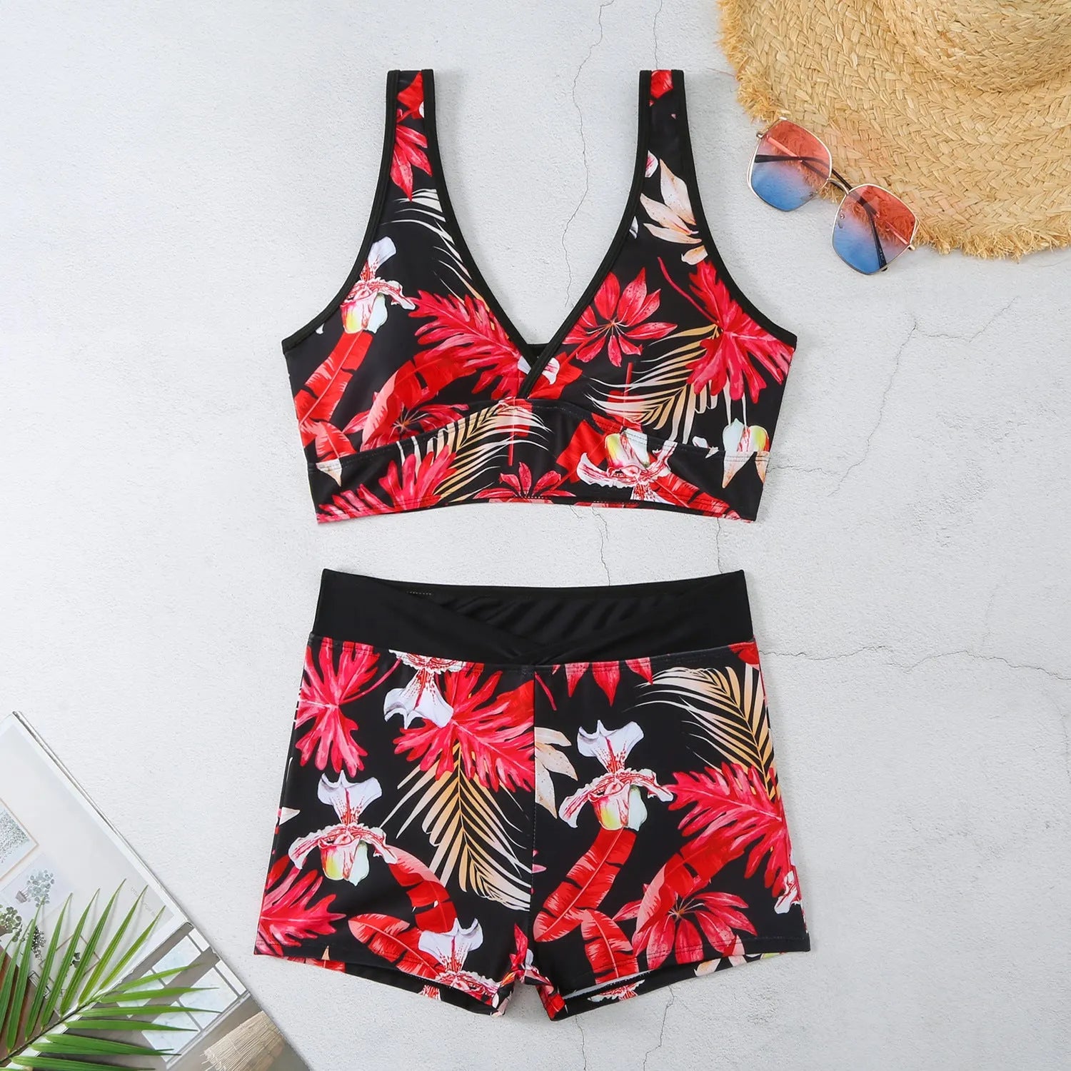 Women's two-piece printed swimsuit with high-neck top and boxer shorts in a multi-colour design.
