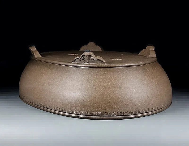 Handmade oval purple sand flowerpot in black mud green colour measuring 50x39.5x16cm