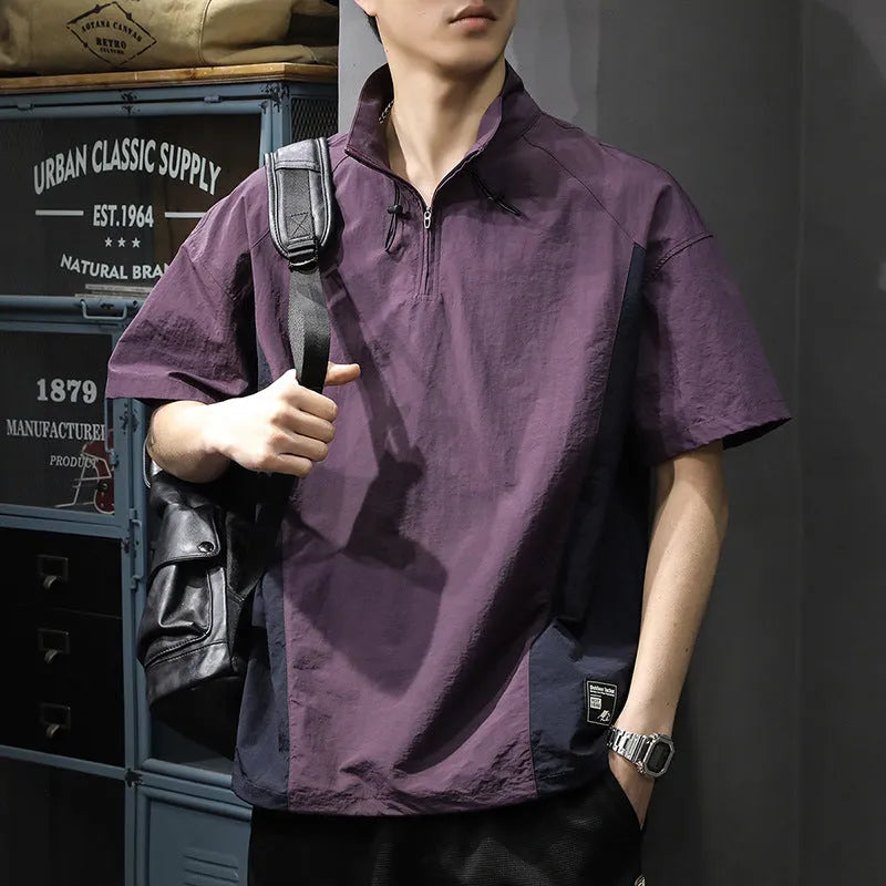 Brown men's half-zip stand collar short sleeve casual shirt laid flat, showing fleece lining and loose fit.