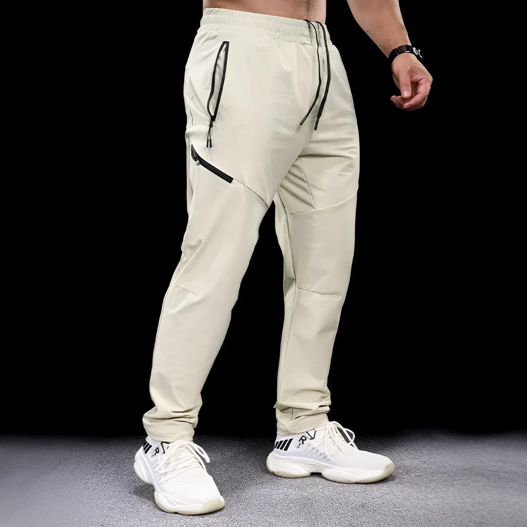 Men's waterproof quick-dry nylon exercise trousers in Army Green colour with mid waist design