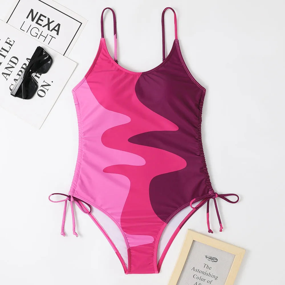 Blue women's sleeveless one-piece swimsuit with fixed swimming trunks on a mannequin.