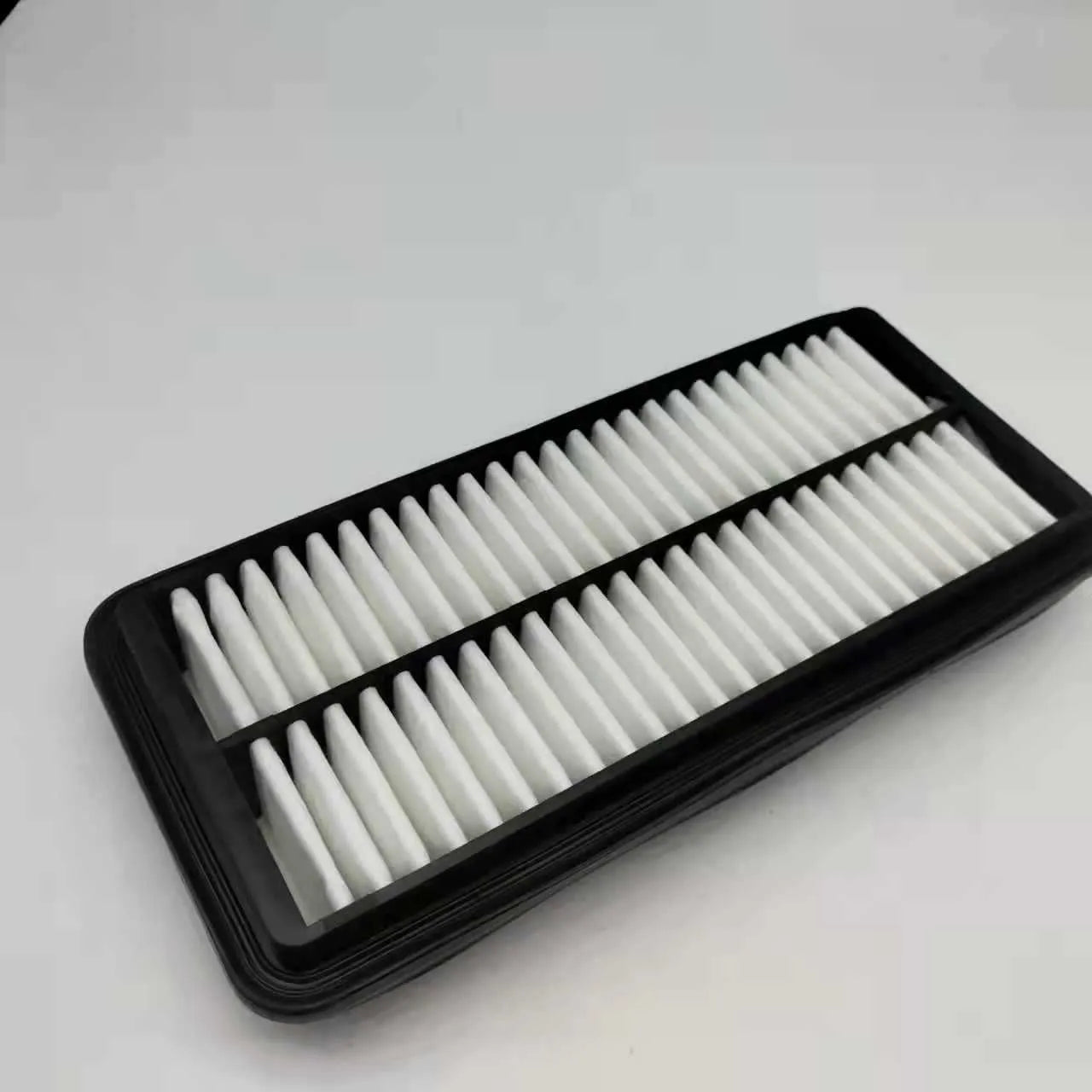 Black Hyundai car engine air filter with dimensions 256mm by 113mm by 40mm