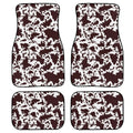 Four-piece set of thick black rubber car floor mats with printed patterns laid out for a vehicle.