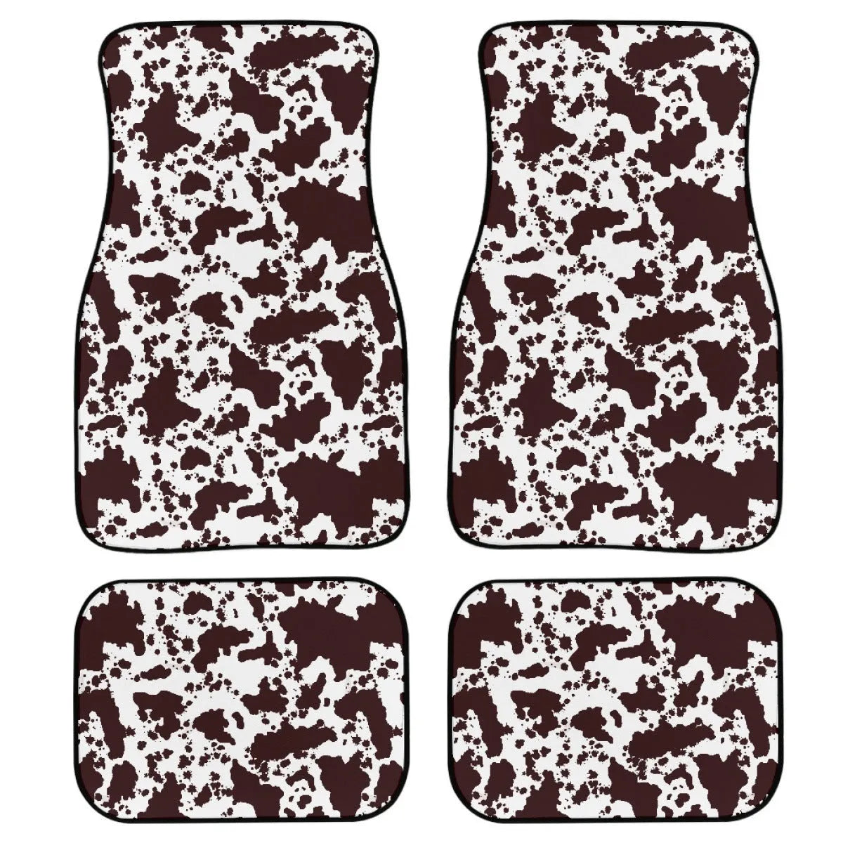 Four-piece set of thick black rubber car floor mats with printed patterns laid out for a vehicle.