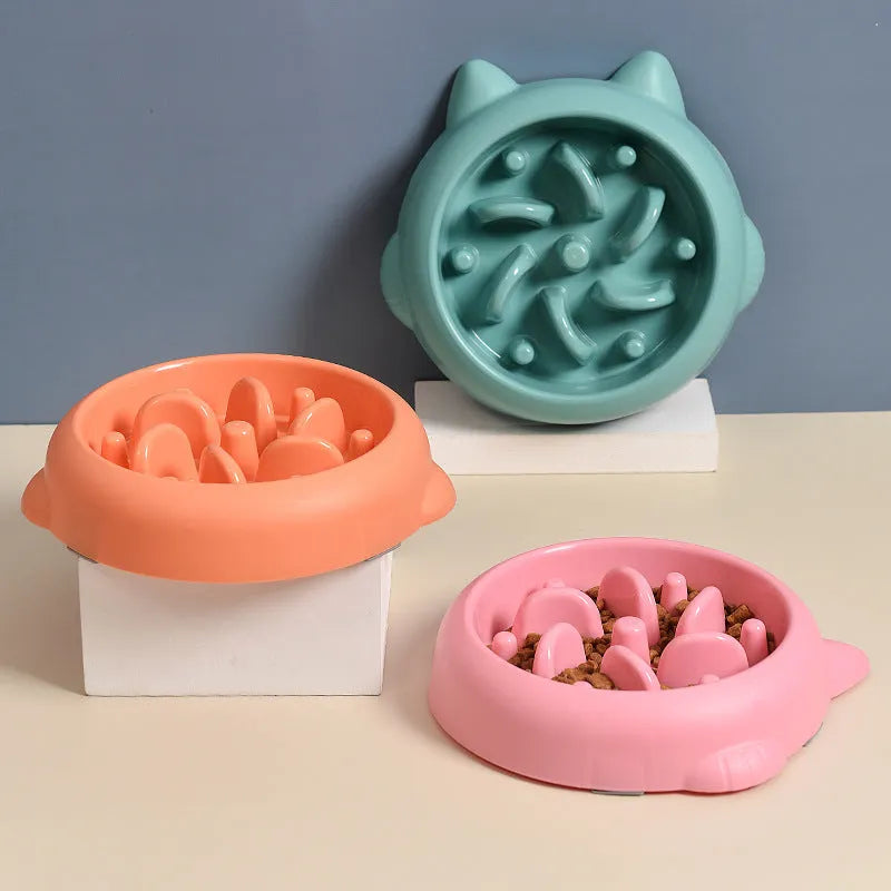Green pet slow feeder bowl with bone-shaped raised ridges