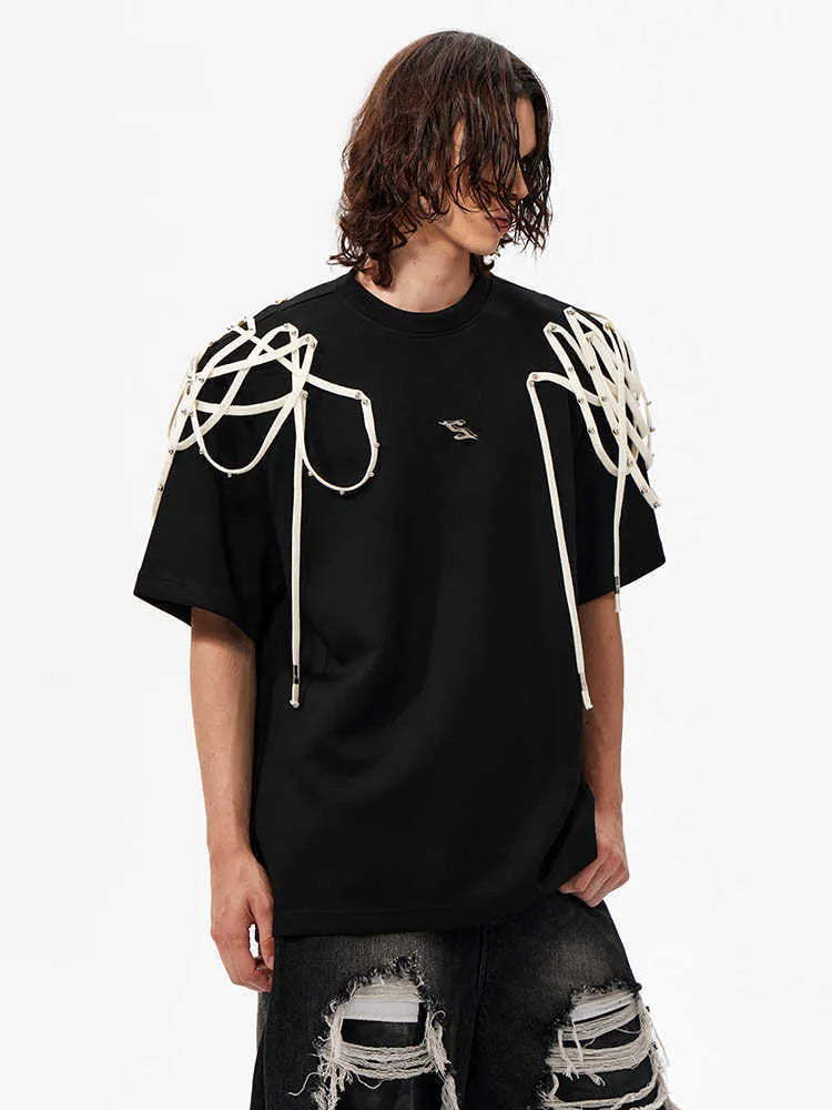 Black loose-fit short-sleeved t-shirt with padded shoulder detail and ribbed cotton texture.