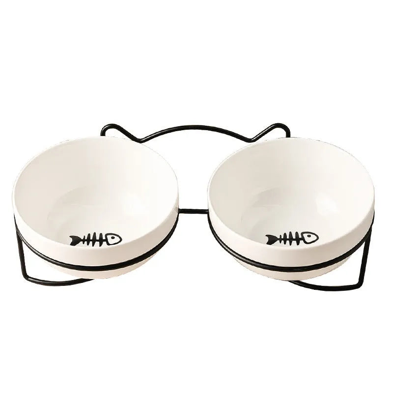 Ceramic cat bowl with iron frame stand showing cat paw print pattern and gold metal finish