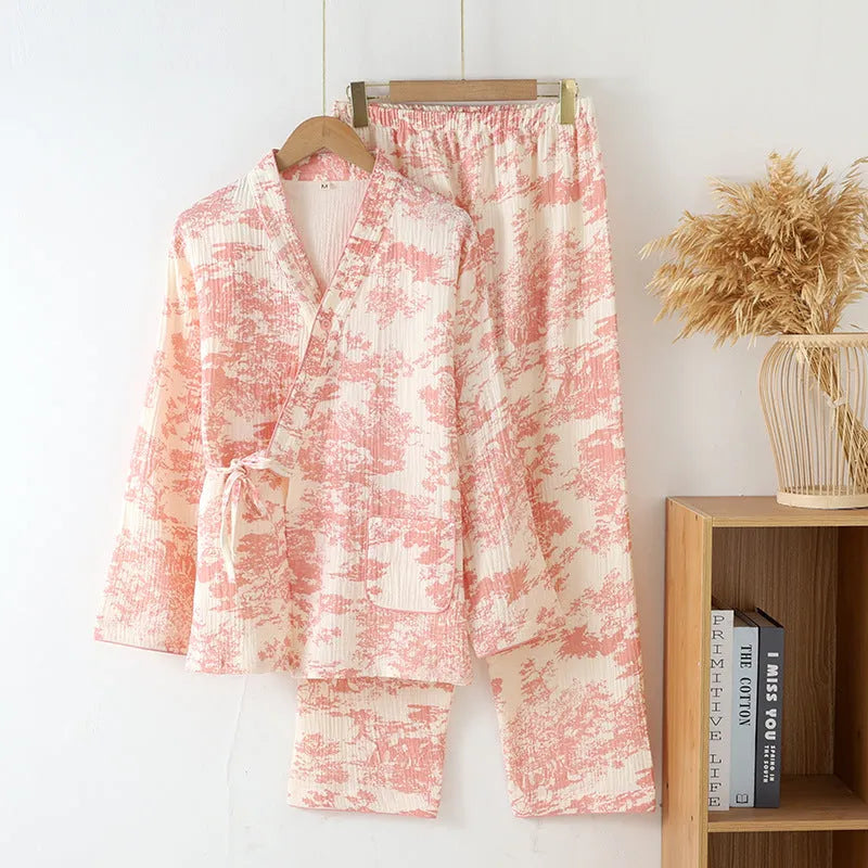 Women's pink pure cotton gauze long sleeve lounge suit top and trousers on a hanger.
