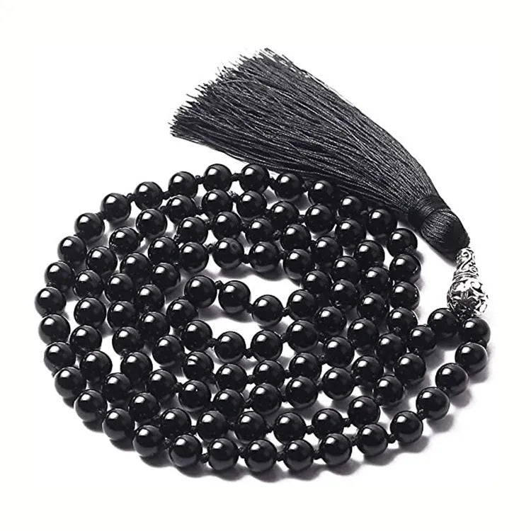 Long multi-strand agate tassel necklace with geometric pattern of amethyst, lapis lazuli, and blue stone beads.
