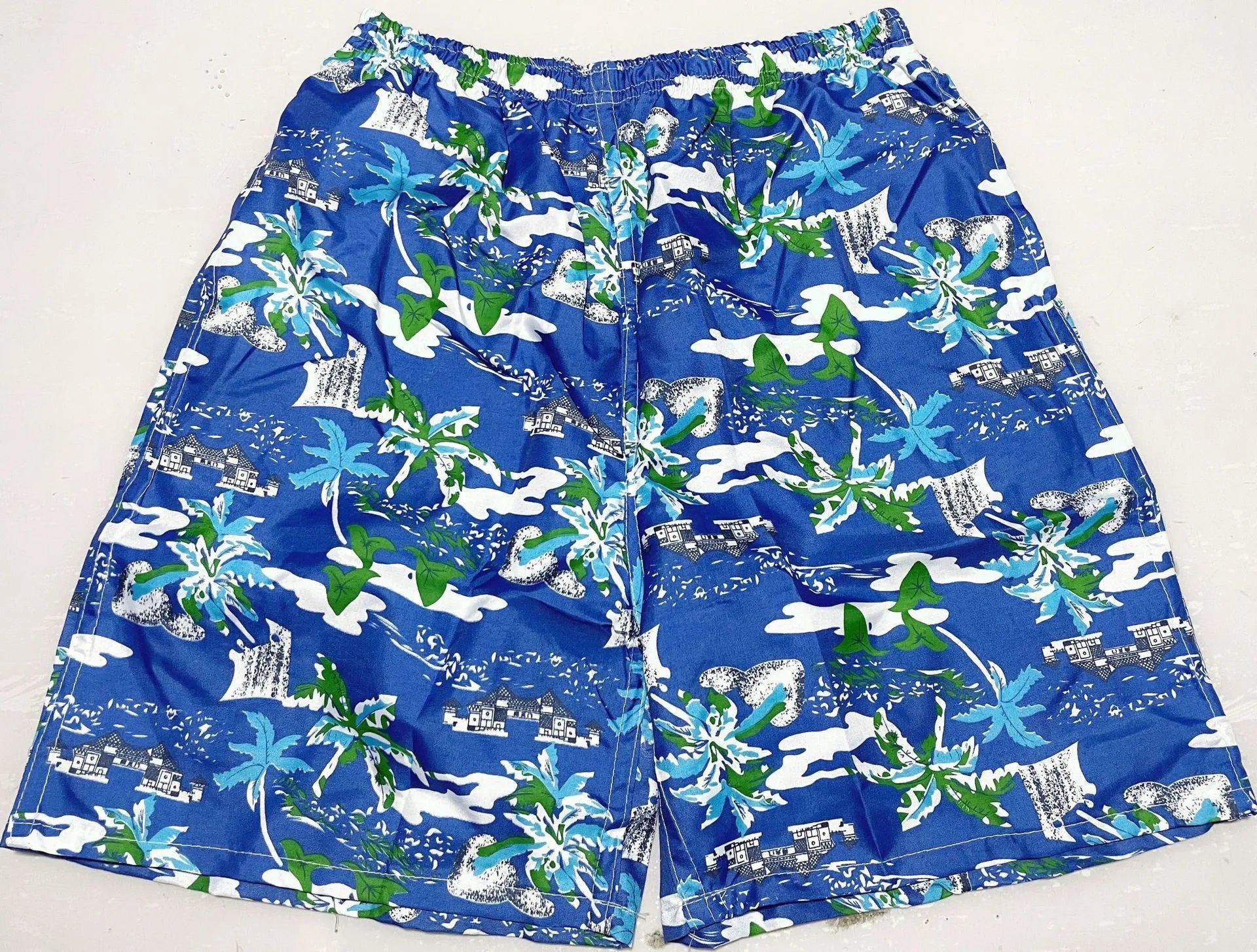 Men's floral print five-point swimming trunks made from polyester in a free size.