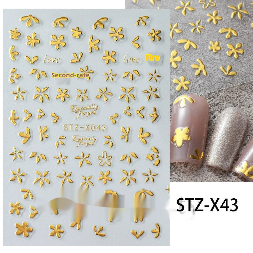 Plastic sheet of black, silver, and cartoon design nail art stickers for DIY manicures.