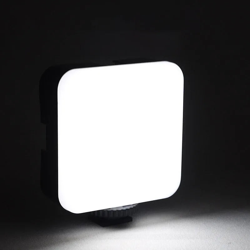 LED mini square outdoor pocket light tripod with top flash measuring 7.3cm by 2.8cm by 8.4cm