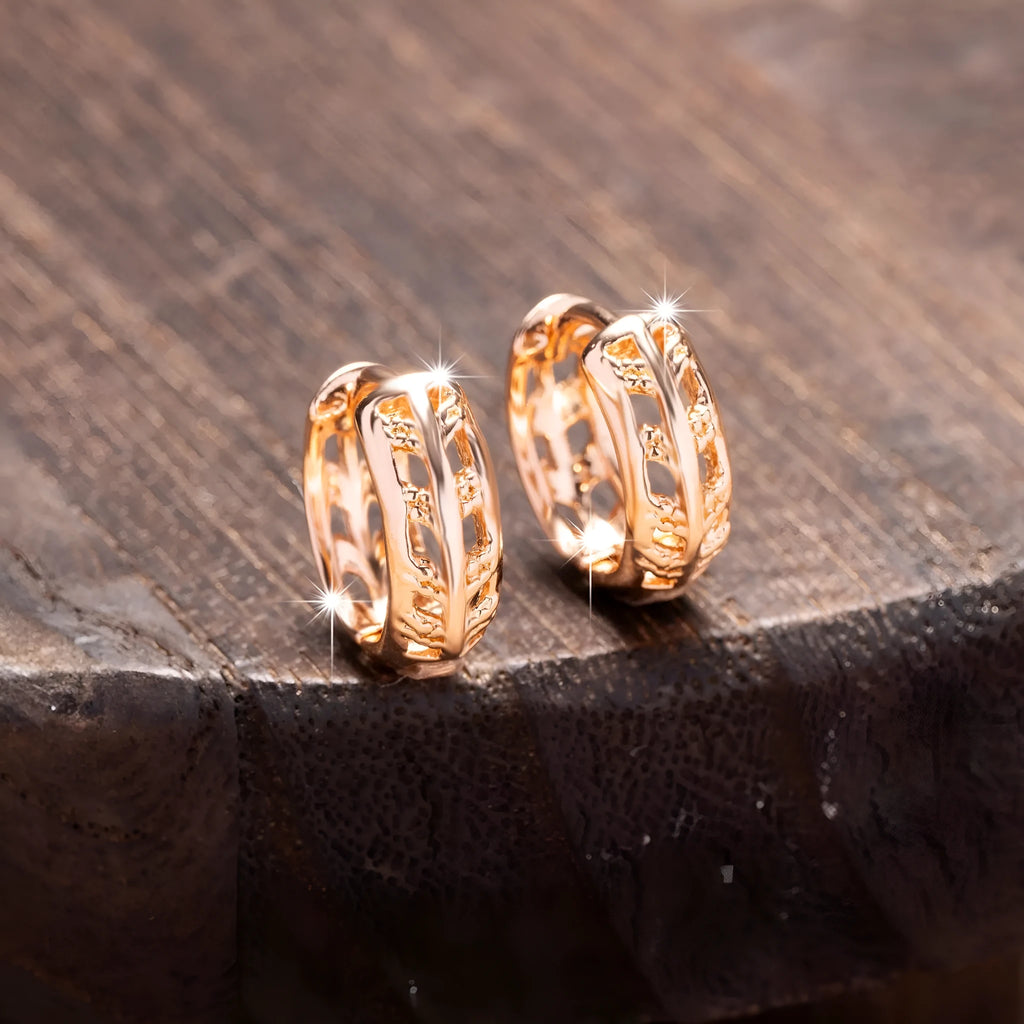 Copper rose gold hollowed-out leaf earrings with heart-shaped details