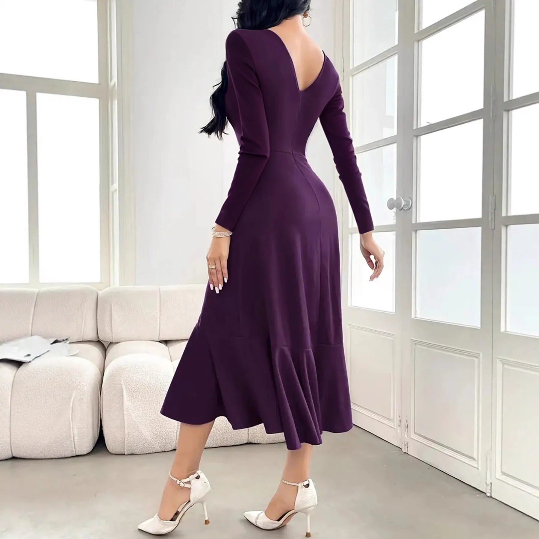 Purple women's long sleeve dress with ruffle detail and a mid waist fit.