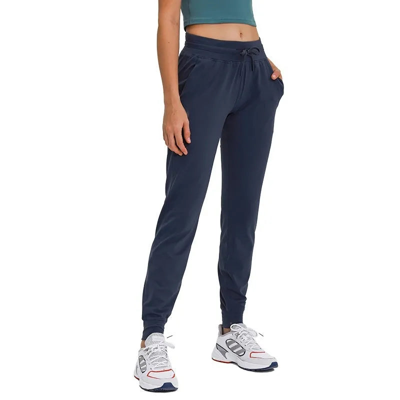 Women's high-waist yoga pants with drawstring waistband in distilled coffee colour, suitable for fitness.