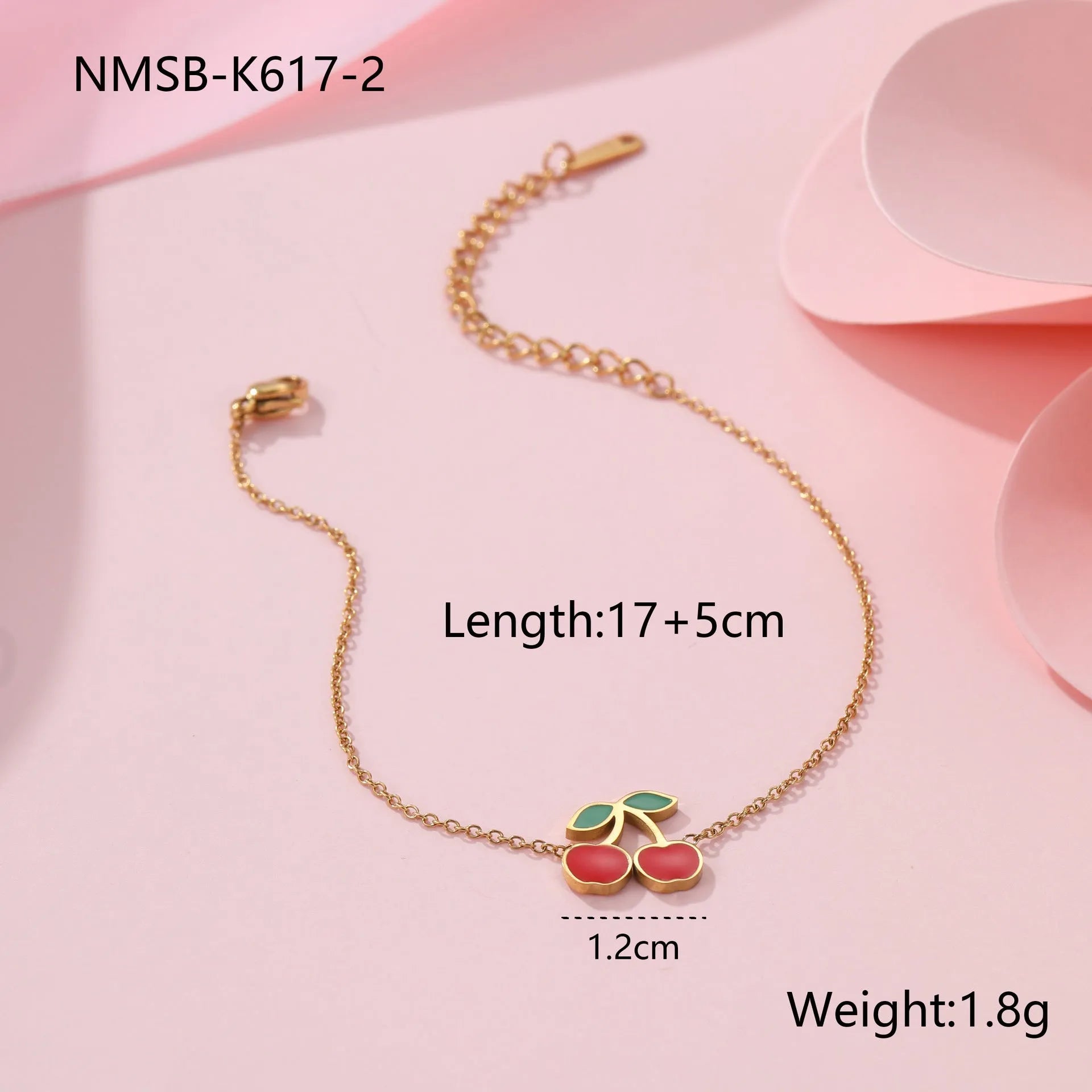 Cherry shaped jewellery set with necklace, bracelet, earrings, and ring in gold-plated stainless steel