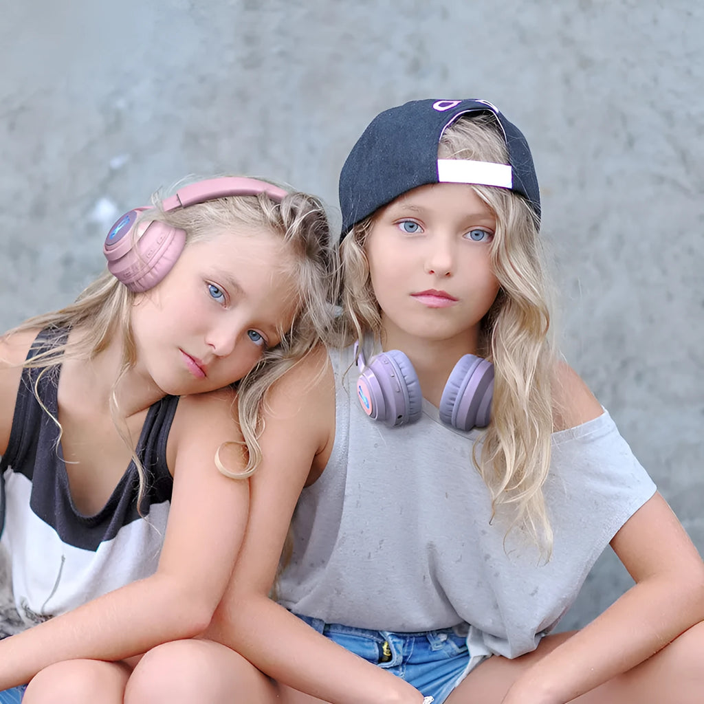 Wireless children's headphones with RGB LED lights in bunny pink colour with stereo sound and microphone