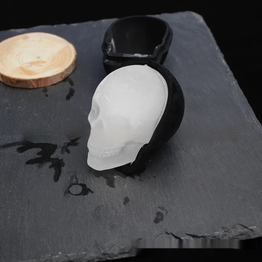 3D Halloween skull-shaped silicone ice cube tray on a white background.