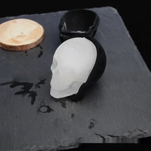 3D Halloween skull-shaped silicone ice cube tray on a white background.