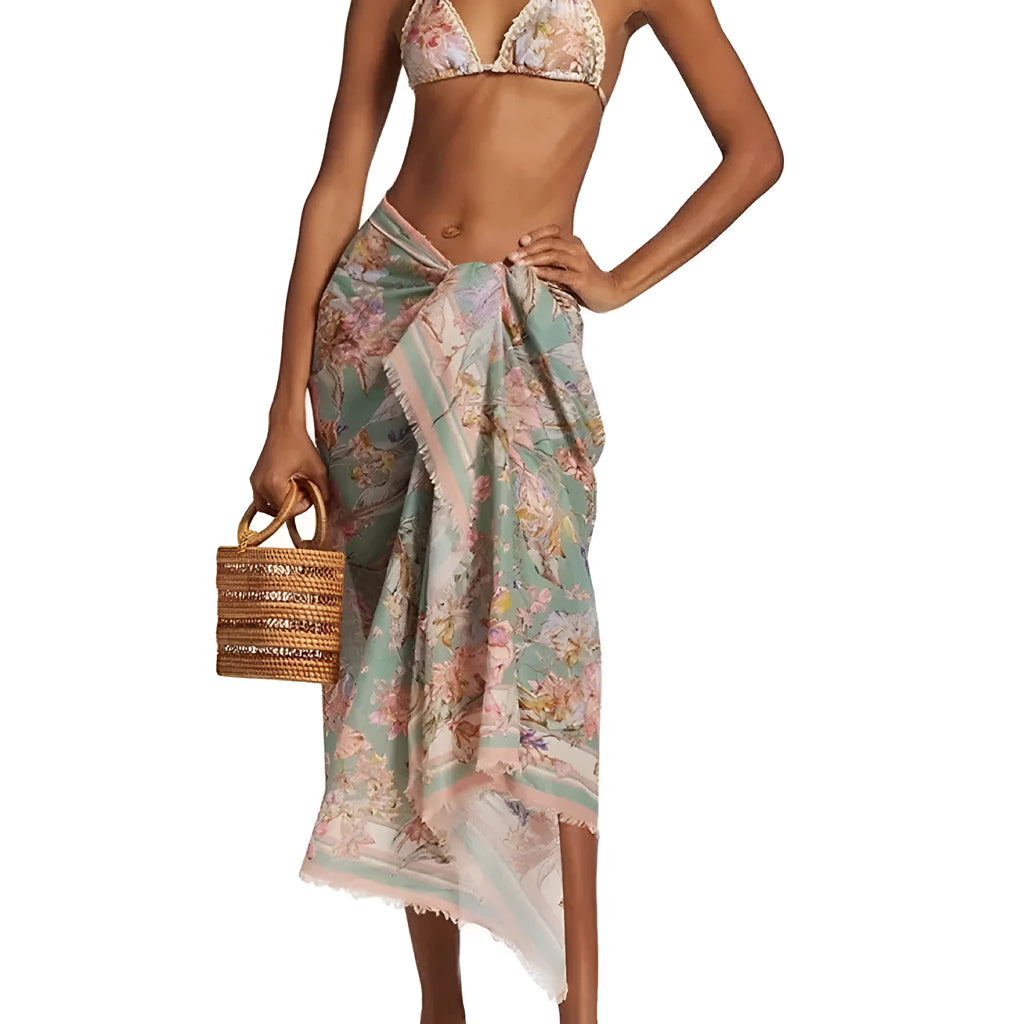 Women's creamy-white floral bikini set with matching skirt for beach and swimming