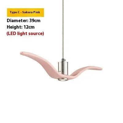 Nordic style ceiling chandelier with macaron colour options shown in a dining room setting.