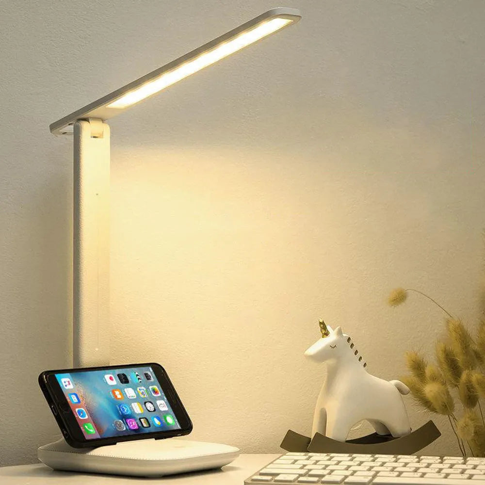 White plastic bedside lamp with touch controls for children's bedrooms