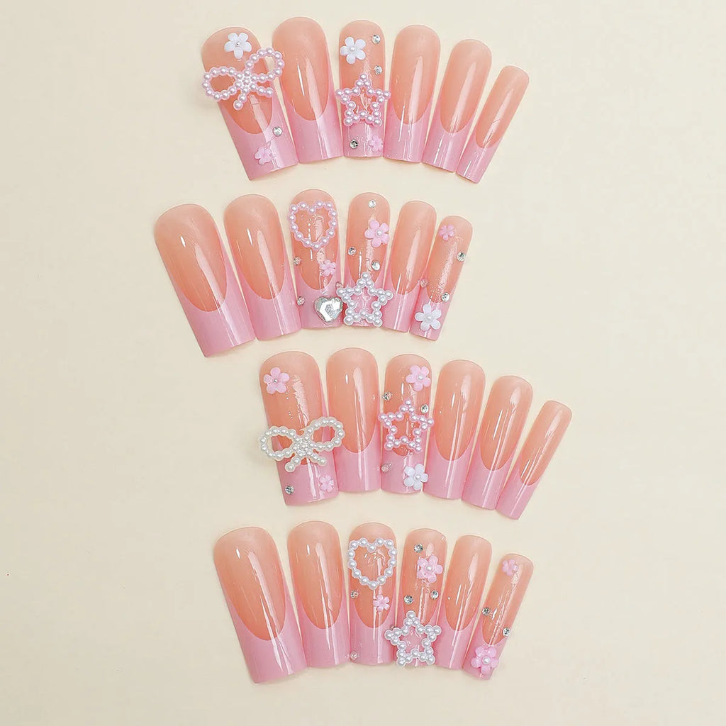 Super long artificial nails with French spot drill, a bow, and a love pattern in colour XB-70-48.