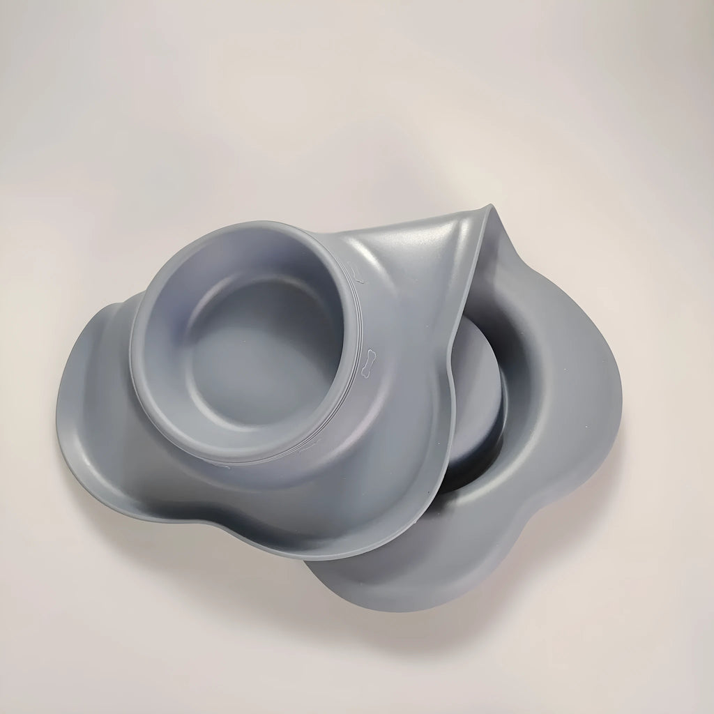 Large silicone dog bowl with stainless steel insert in choice of five colours on a plain background.